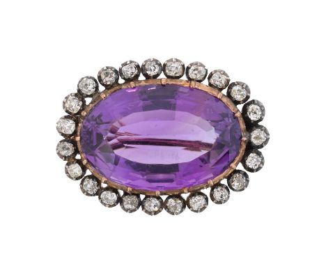 A late Victorian amethyst and diamond brooch, A late Victorian amethyst and diamond brooch, the oval shape amethyst weighing 