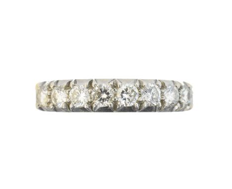 An 18ct gold diamond band ring, An 18ct gold diamond band ring, the brilliant cut diamond line within claw settings, estimate