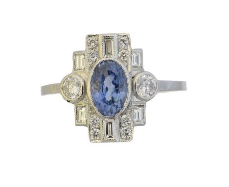 A sapphire and diamond cluster ring, A sapphire and diamond cluster ring, the oval shape sapphire within a brilliant and bagu
