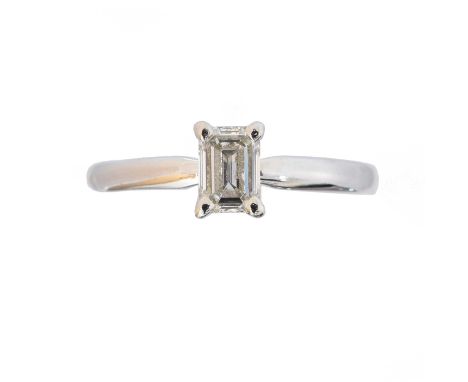 An 18ct gold diamond single stone ring, An 18ct gold diamond single stone ring, the emerald cut diamond weighing 0.57ct withi