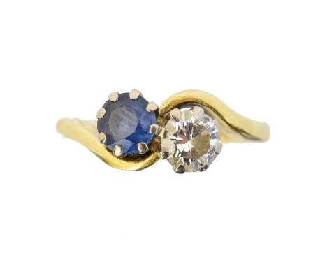 An 18ct gold sapphire and diamond crossover ring, An 18ct gold sapphire and diamond crossover ring, the circular shape sapphi