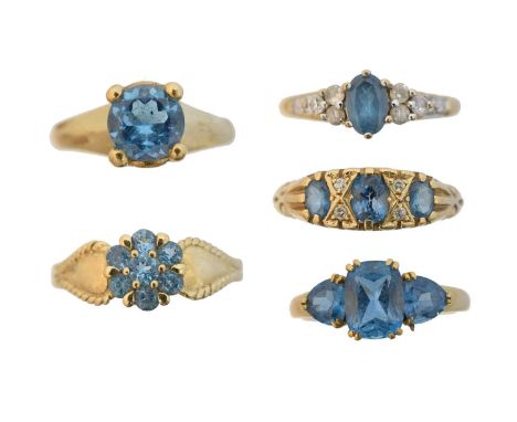 Five 9ct gold blue topaz dress rings, Five 9ct gold blue topaz dress rings, to include a single stone ring, a three stone rin