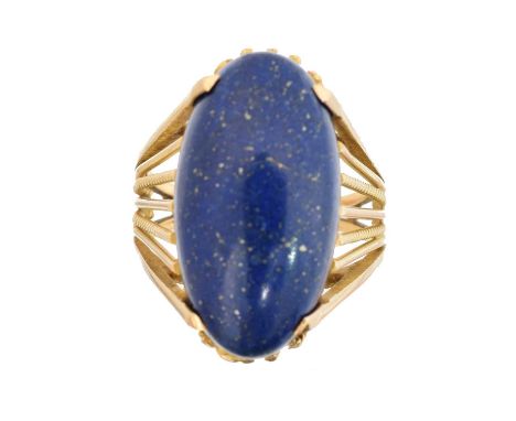 A lapis lazuli dress ring, A lapis lazuli dress ring, the oval lapis lazuli cabochon with tapered openwork shoulders, ring si