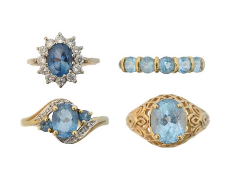 Four 9ct gold blue topaz dress rings, Four 9ct gold blue topaz dress rings, to include a single stone ring, a blue topaz and 