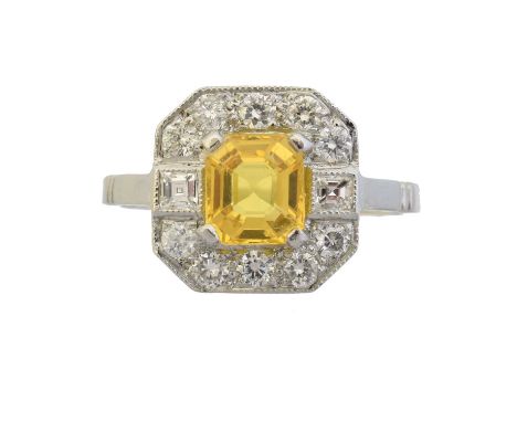 A sapphire and diamond cluster ring, A sapphire and diamond cluster ring, the rectangular shape yellow sapphire within a bril