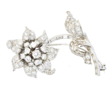 A diamond floral brooch, A diamond floral brooch, the vari-cut diamond floral cluster with baguette cut diamond curved stem, 