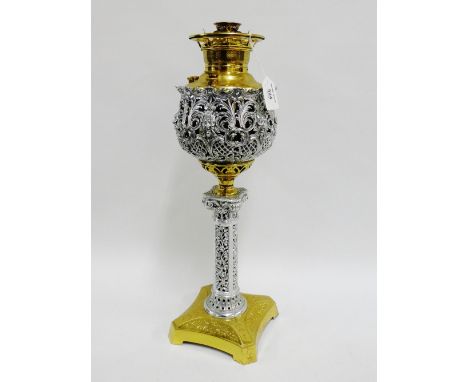 The Miller Lamp USA, a brass and white metal oil lamp, 52cm high overall