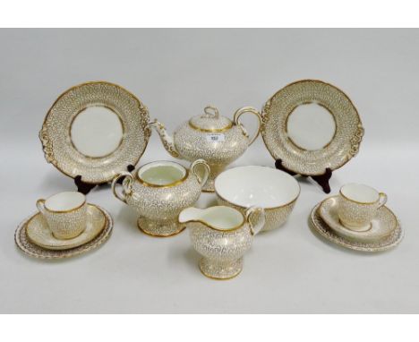 19th century white glazed porcelain and gilt decorated teaset comprising teapot, sucrier, slop bowl, milk jug, eight cups, si