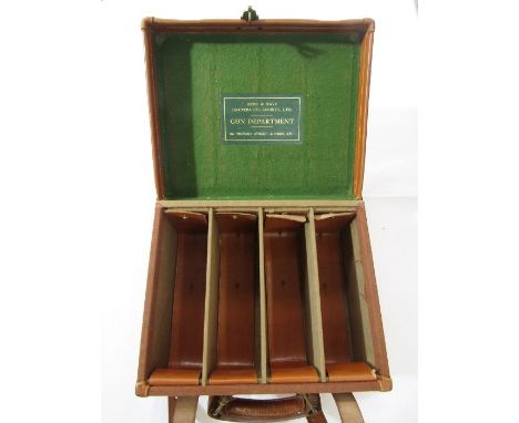 Leather Army and Navy Co-operative Society case, together with a smaller canvas and leather case. Both designed to carry shot