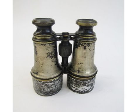 WWI era binoculars in leather case stamped with broad arrow. Together with an artillery clinometer stamped FBP in leather cas