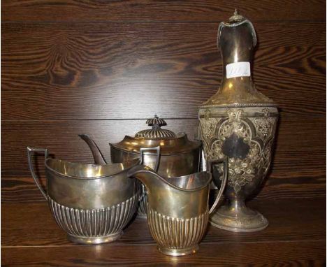 VICTORIAN SILVER PLATED HOT WATER JUG
and a silver plated three piece tea service, the jug 34cm high (4)