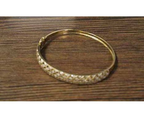 NINE CARAT GOLD DIAMOND SET BANGLE
of pierced form
No damage