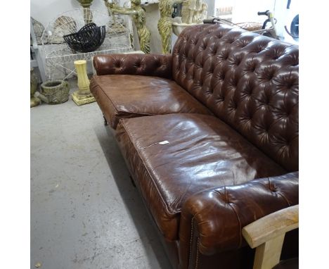 A George Smith Bulgari brown leather upholstered button-back Chesterfield settee / sofa, with 2 loose cushions, on turned mah