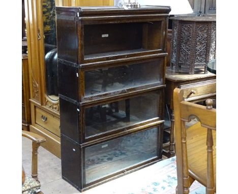 An oak 4-section Globe-Wernicke bookcase (no base), W87cm, H135cm, D31cm 