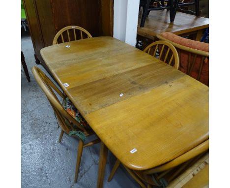 An Ercol light elm drop leaf table, on beech tapered legs, together with a set of 4 matching Ercol elm-seated stick-back chai