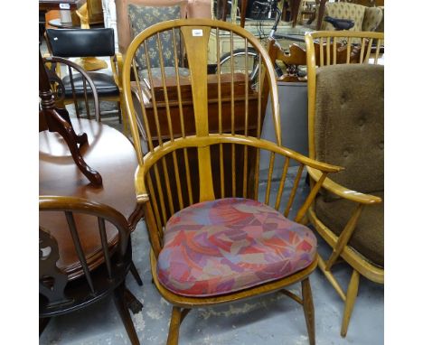 A modern Ercol elm-seated Windsor bow-arm stick-back elbow chair 