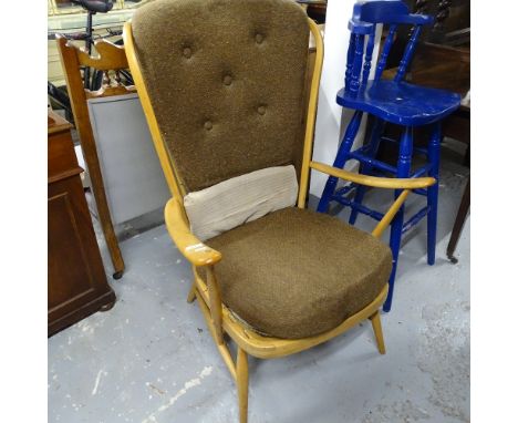 An Ercol beech Windsor stick-back armchair, with loose cushions 