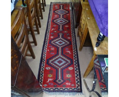 A red ground Turkey runner, 270cm x 73cm 