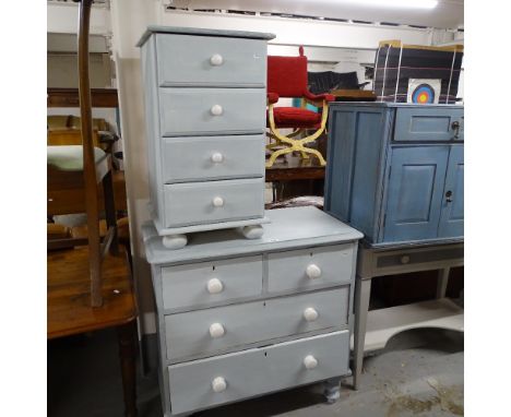 A painted pine 4-drawer chest, with ceramic handles, on bun feet, and a matching 4-drawer bedside chest (2) 
