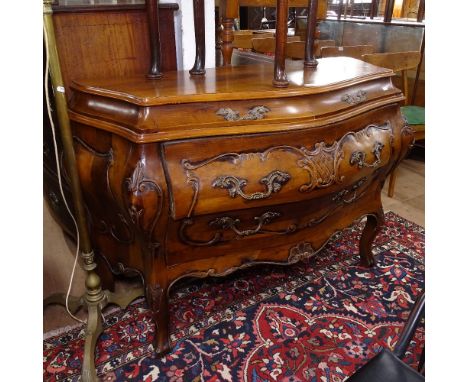 A Continental design stained wood bombe commode of serpentine form, with 2 short and 2 long drawers, on cabriole legs, W120cm
