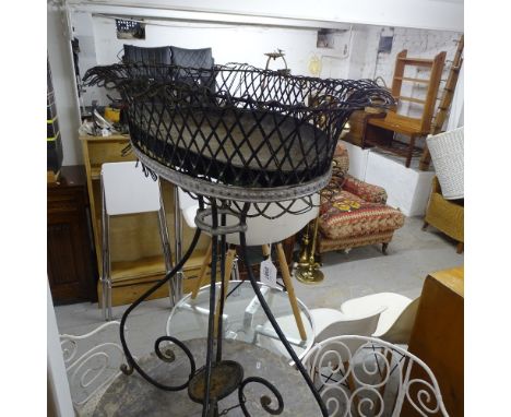 A French oval wirework planter on scrolled stand 