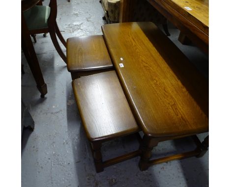 An Ercol dark elm Windsor rectangular nest of 3 occasional tables, L112cm 