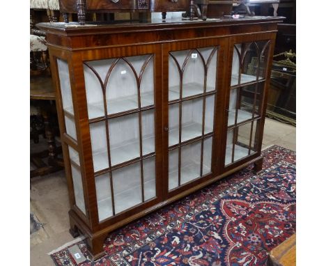 An Edwardian mahogany bookcase, with 3 arch-top lattice-glazed doors, on bracket feet, W144cm, H111cm, D32cm 