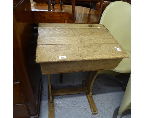 A Vintage oak school desk, W57cm, H80cm, D47cm 