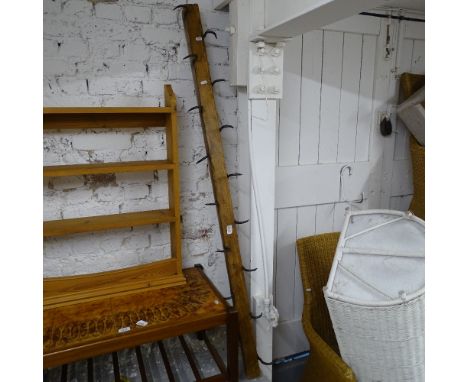 A Vintage set of butcher's hooks, mounted on pine beam, L60cm 