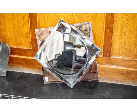 A Mid Century Art Deco Style Wall Mirror of star form with bevelled glass and peach panels. 23 inch square. 
