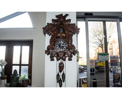 A Large Kaiser Musical Cuckoo Clock of typical design and form. Overall height 44 inches. 