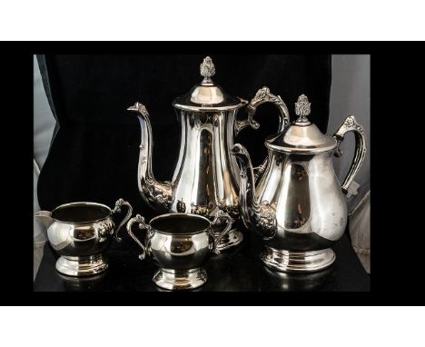 Silver Plated Four Piece Tea Service, comprising tea pot, hot water pot, milk jug and twin handled sugar bowl, all with decor