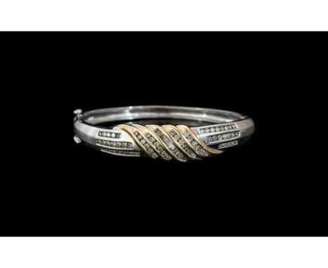 14ct White Gold Diamond Hinged Bangle, The Front Set With Channel Set Round Brilliant And Tapering Baguette Cut Diamonds, Est