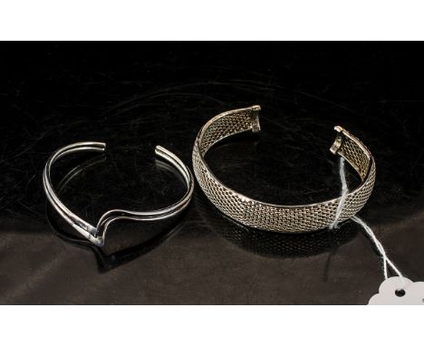 Two Silver Bangles, comprising a solid twin band style bangle, and a silver mesh bangle.  Both fully hallmarked.