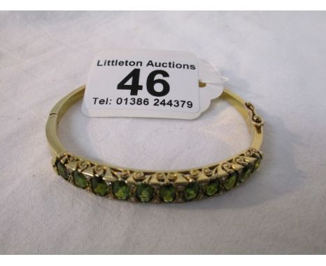 9ct gold green tourmaline and diamond set bangle (cost £800 in 1999) - approx 16g - Estimate £200 - £300