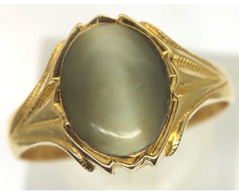 Unmarked 18ct gold and cats eye ring, size Q/R, 5.4g. Stone size 12 x 9 mm. P&amp;P Group 1 (£14+VAT for the first lot and £1