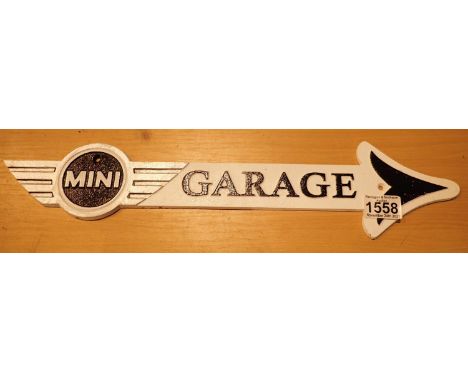 Cast iron Mini Garage arrow shop sign, L: 50 cm. P&amp;P Group 1 (£14+VAT for the first lot and £1+VAT for subsequent lots) 