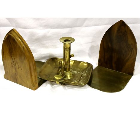 Pair of ecclesiastical walnut and brass bookends and a 19th century brass chamber stick. Not available for in-house P&amp;P, 