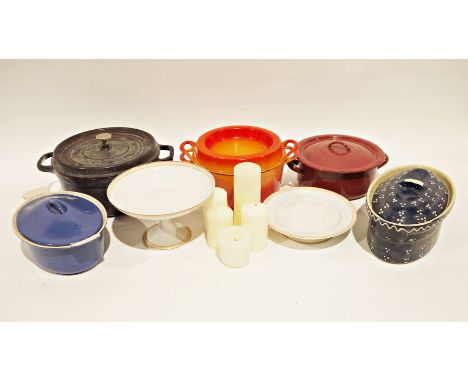 Le Creuset cast iron and enamel blue and white lidded casserole, a Doufeu cast iron and orange enamel lidded casserole, a Sta