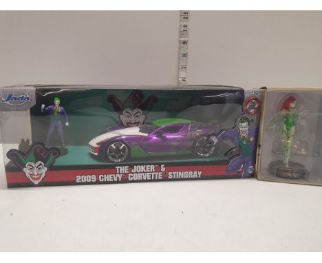 A boxed the Joker 2009 Chevy Corvette Stingwray die cast model by Jada and one other 