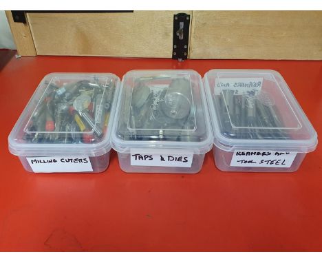 A selection of engineering tools including taps and dies, milling cutters, reamers and drill bits, shipping unavailable