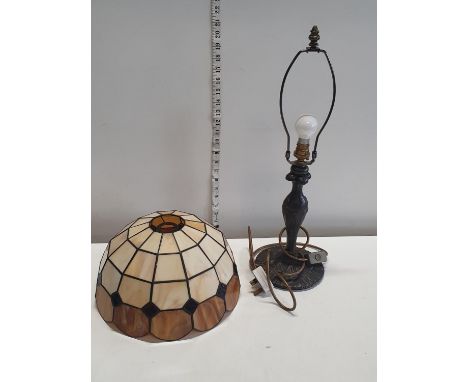 A tiffany style lamp shade with an Art Nouveau style lamp base. shipping unavailable 