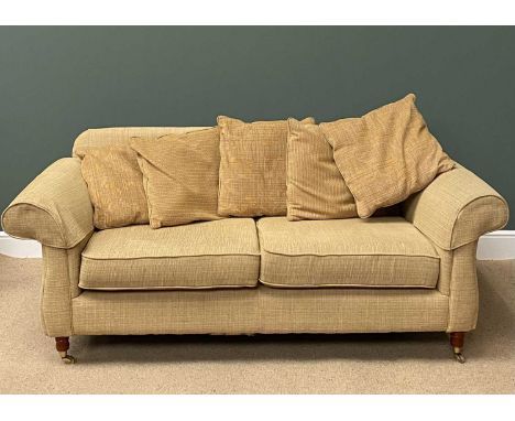 CONTEMPORARY SOFA - sand coloured with chrome rear feet and front castors, with scatter cushions, 83cms H, 208cms W, 100cms D