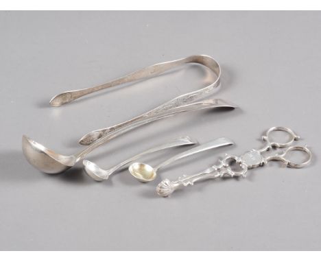 A pair of Georgian silver bright cut sugar tongs, a Georgian silver sauce ladle, a pair of Georgian silver sugar tongs and tw