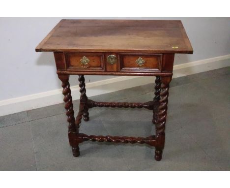 An early 18th century yew side table, fitted one drawer with brass shaped drop handle, on bobbin turned and stretchered suppo