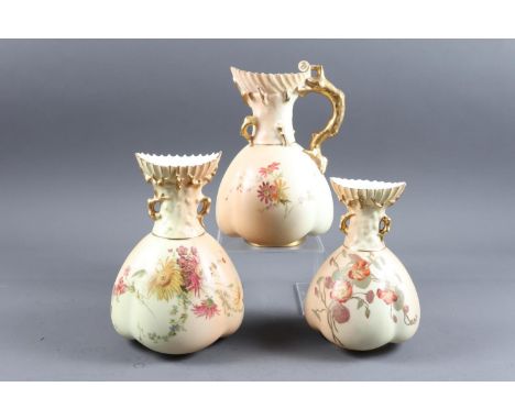 A Royal Worcester blush ivory jug with gilt twig handle and floral decoration, 8 1/2" high, and two similar Royal Worcester s