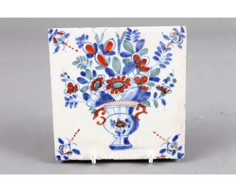 An 18th century London delft polychrome tile with vase of flower decoration (ex Jonathan Horne) 