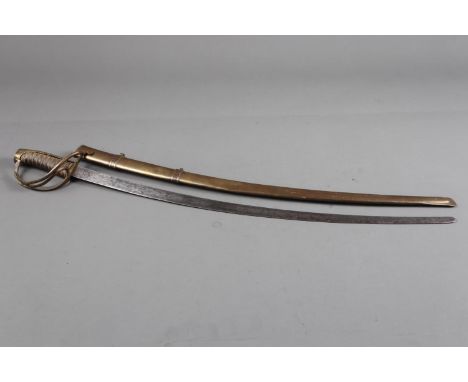 A child's 19th century French sabre with brass scabbard, blade 19 1/4" long