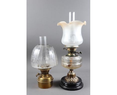 A late 19th century oil lamp and shade with glass reservoir and a brass oil lamp with etched shade, larger 21" high