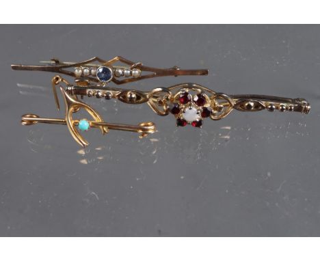 Two early 20th century 9ct gold bar brooches, one set sapphire and seed pearls, one garnets and milk opal and a gilt  brooch 
